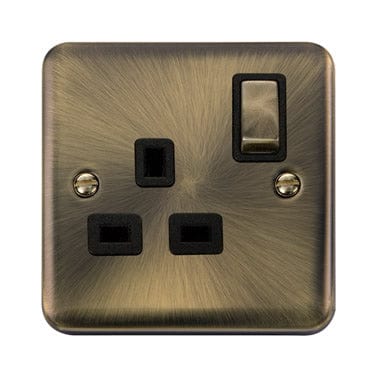 Curved Antique Brass 13A Ingot 1 Gang DP Switched Plug Socket - Black Trim